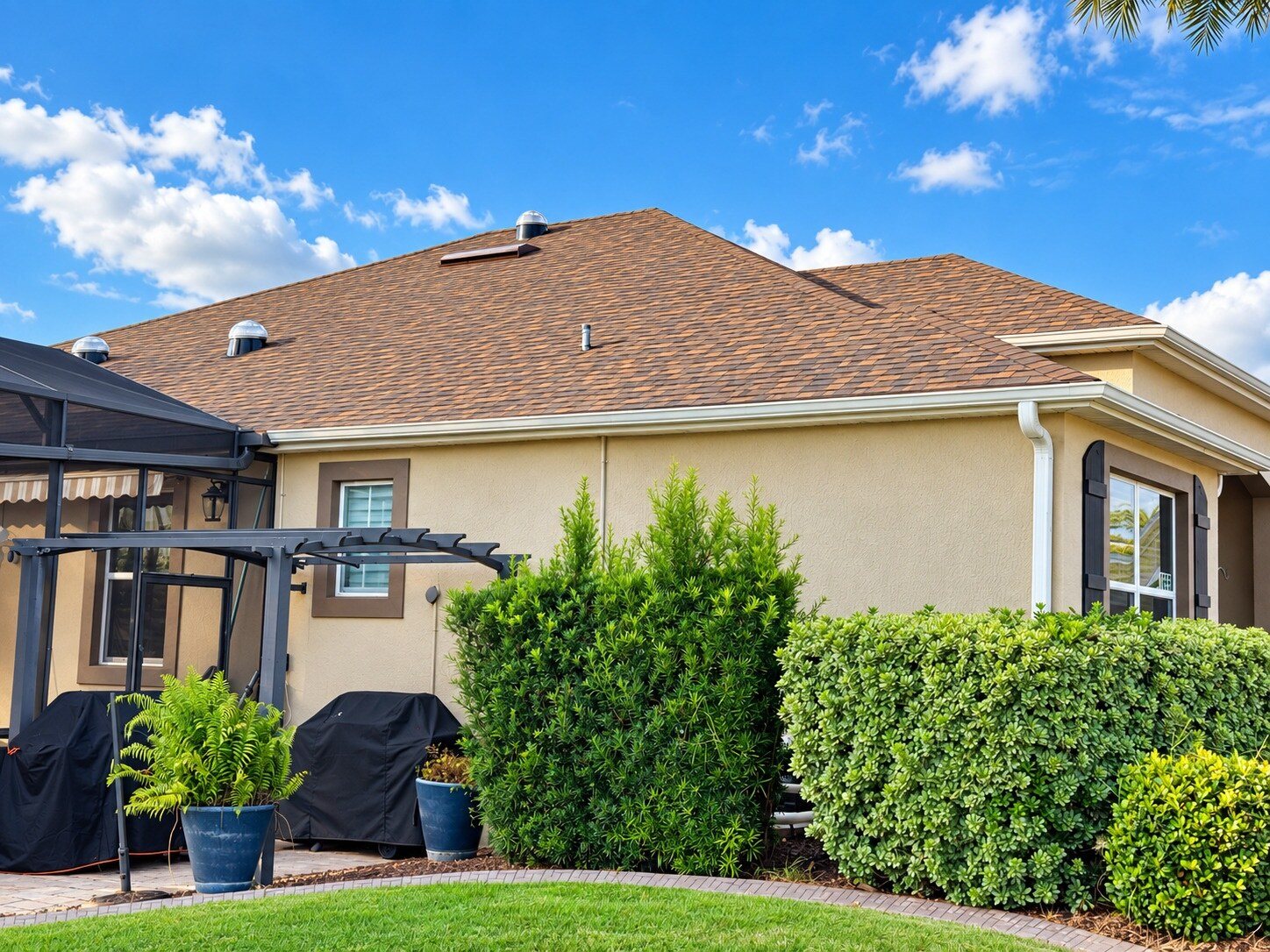 The finished Brownwood roof over the back of the house on a shingle roof in The Villages