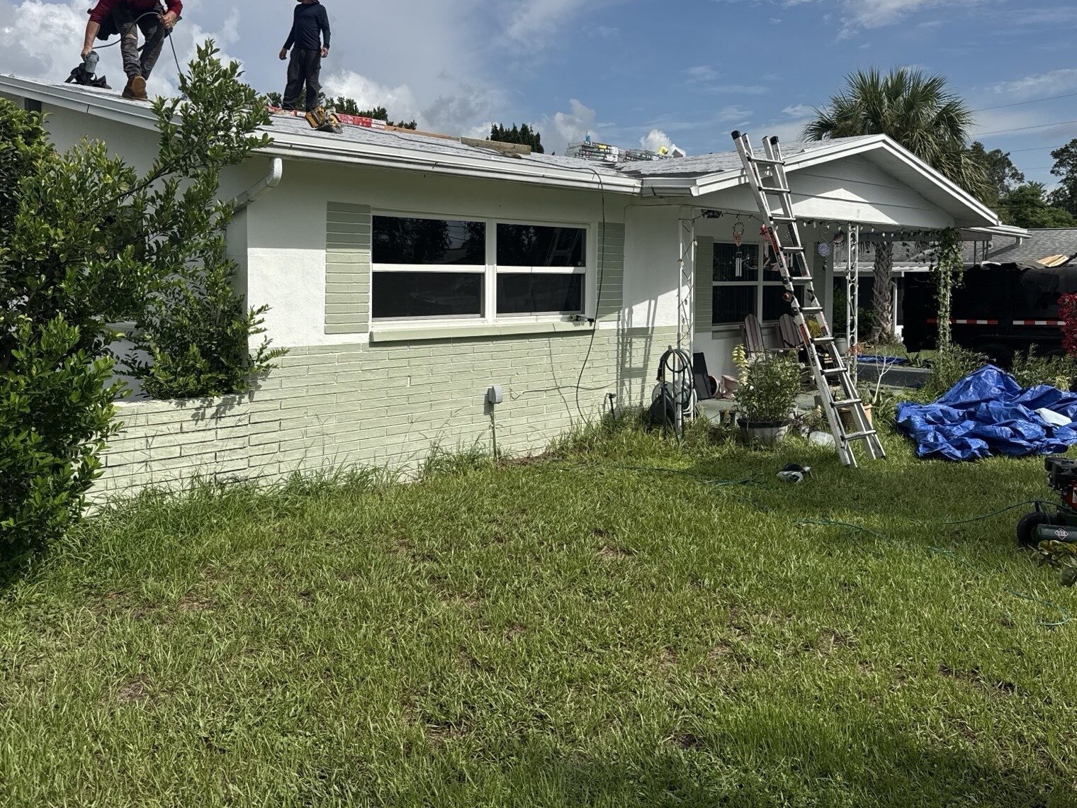 Scotti Family Roofing crew working on the roof of a Beverly Hills FL home during a reroof