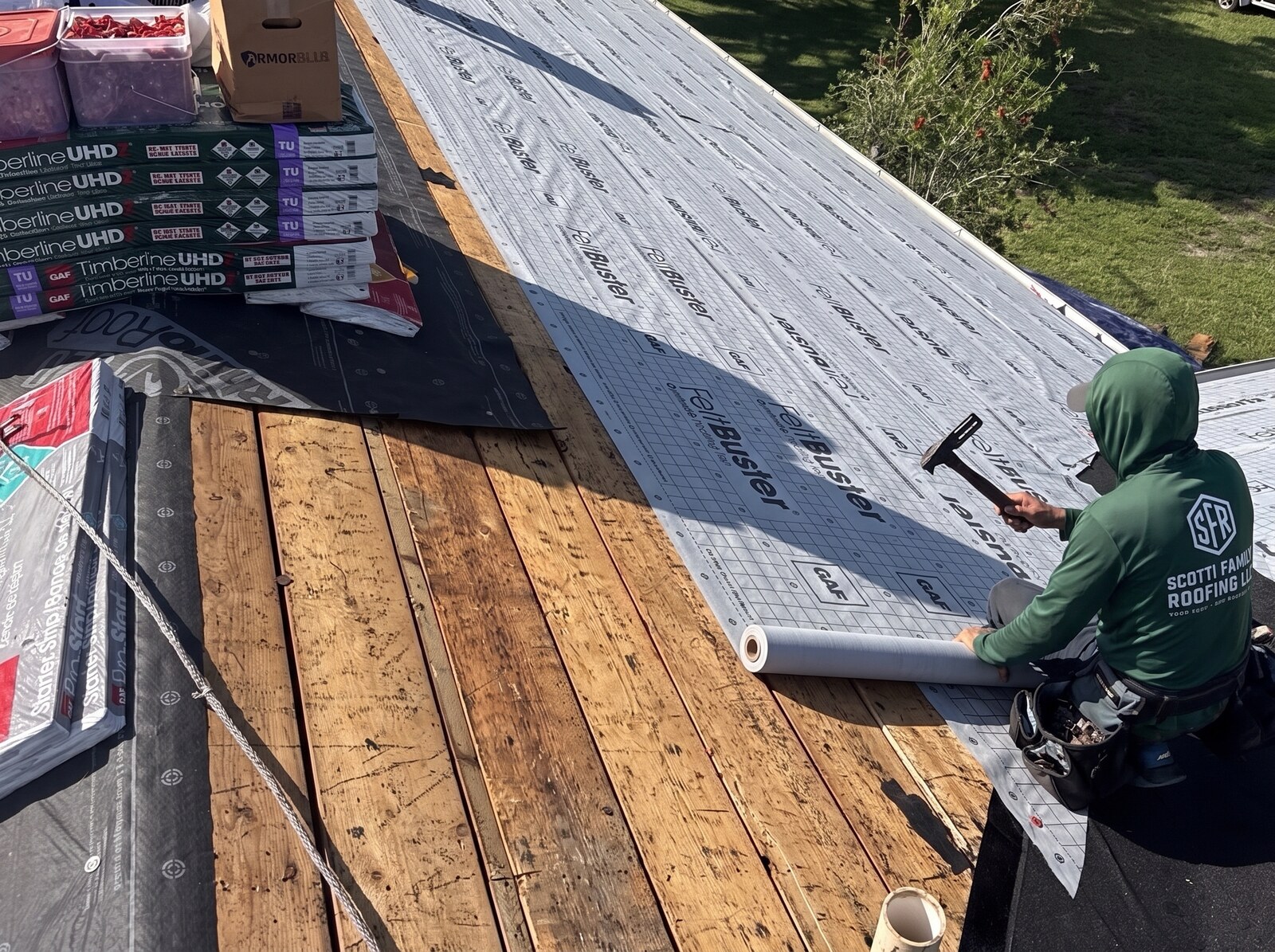 GAF synthetic underlayment rolled across a stripped roof deck on a Spring Hill FL home