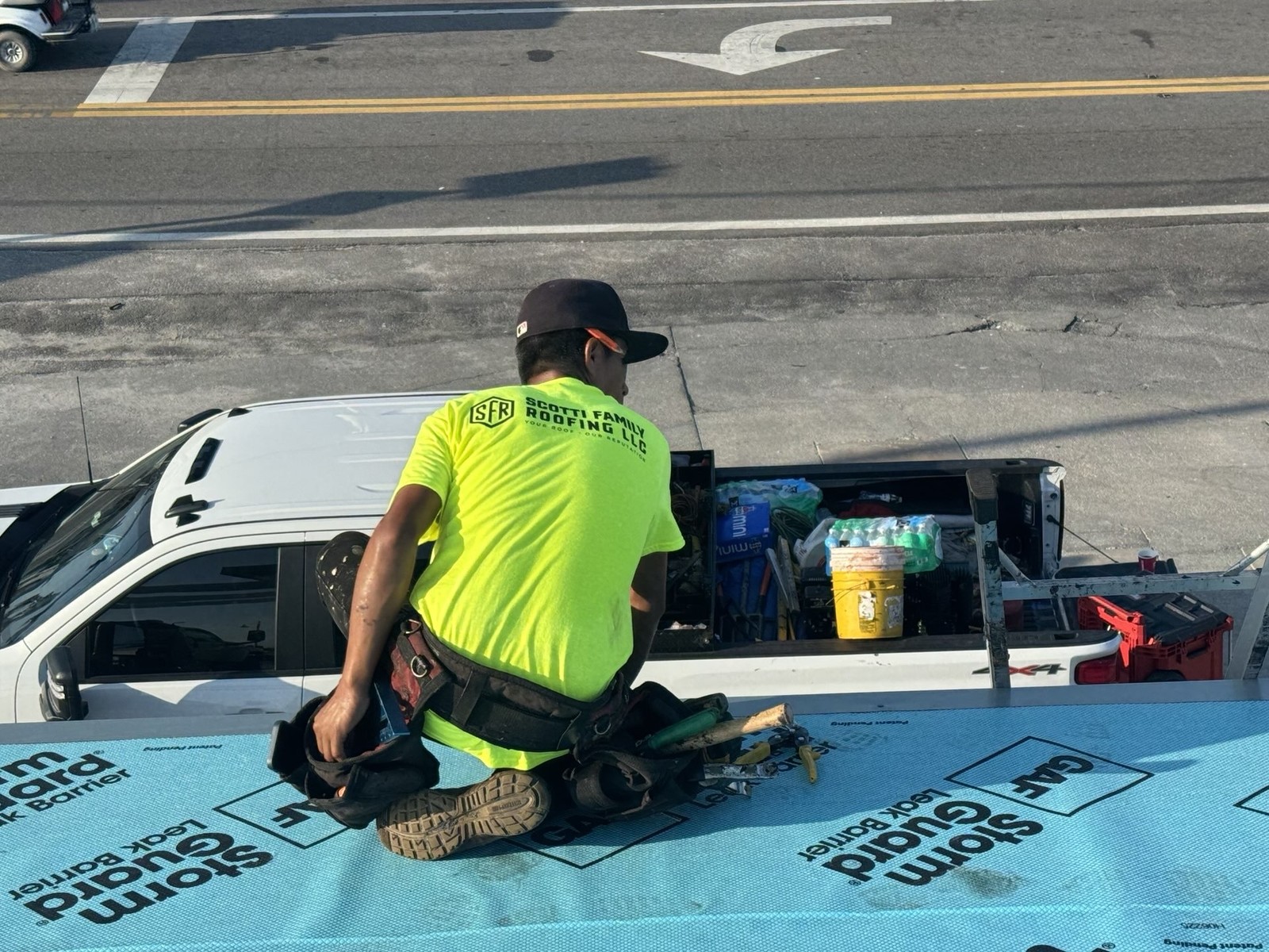 Scotti Family Roofing crew member at work on a Holmes Beach FL metal roof project