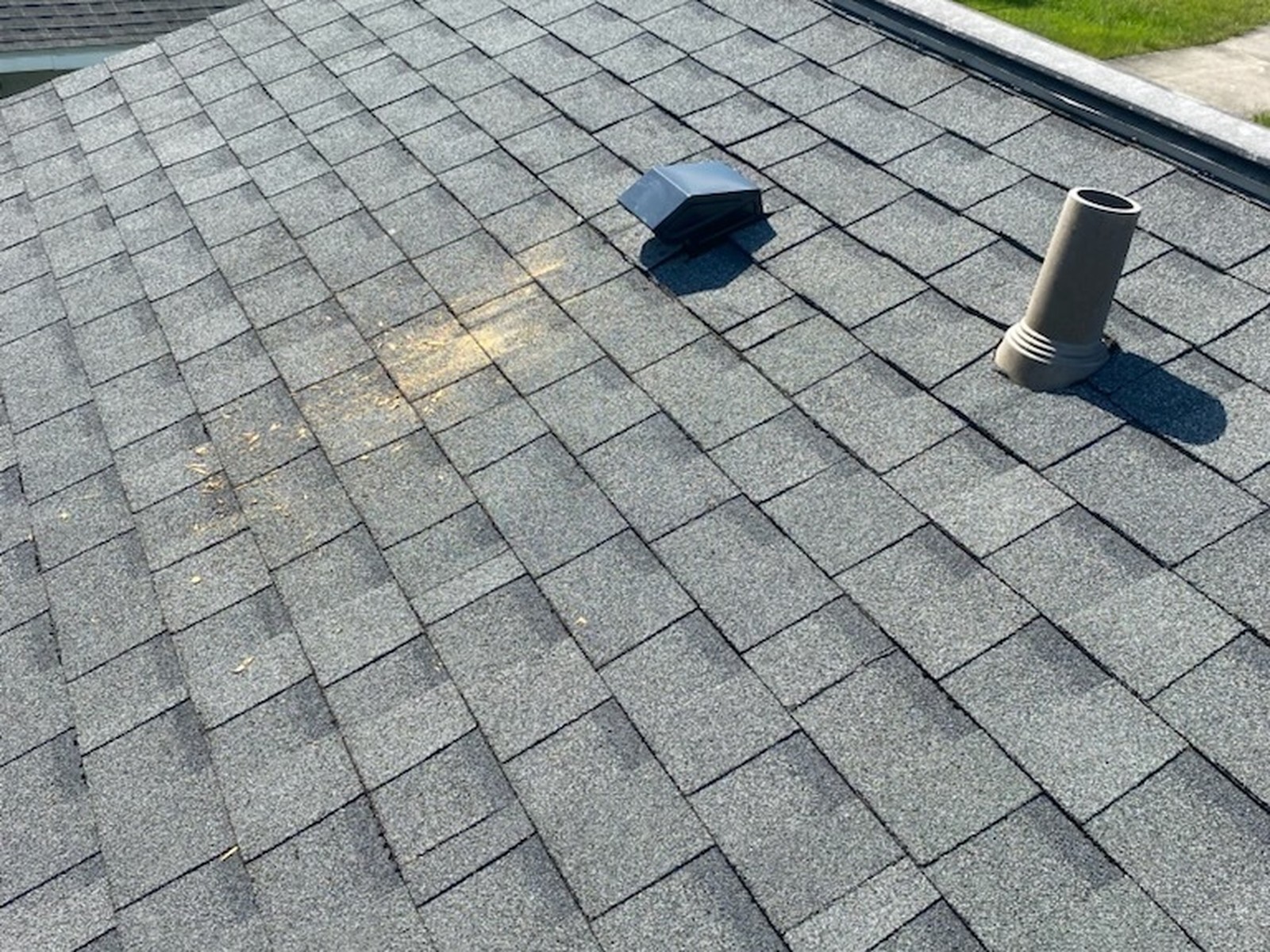 Architectural shingle roof with vents and pipe boot in Dunnellon, FL
