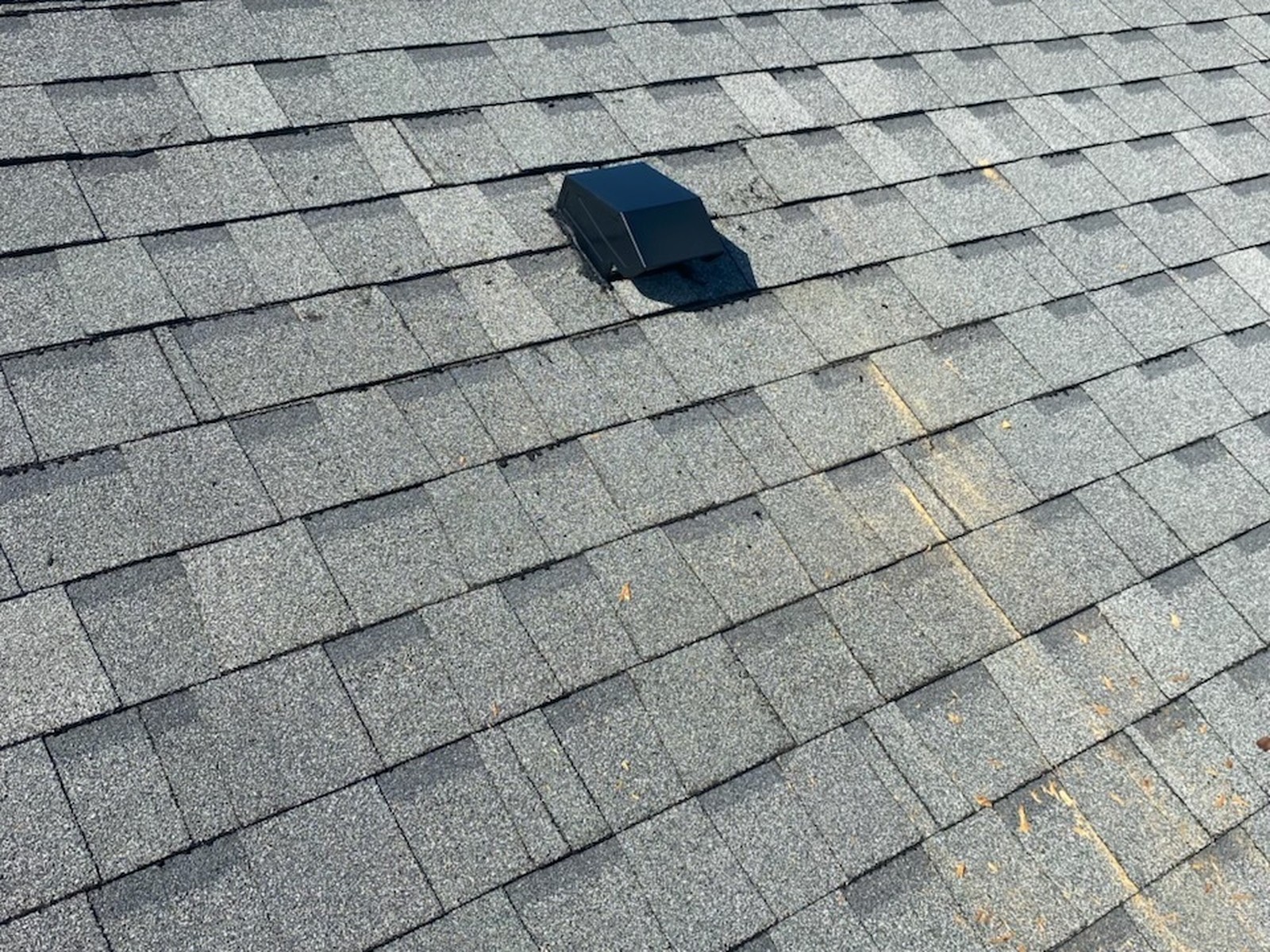 Repaired roof vent and shingles on a Dunnellon, FL home