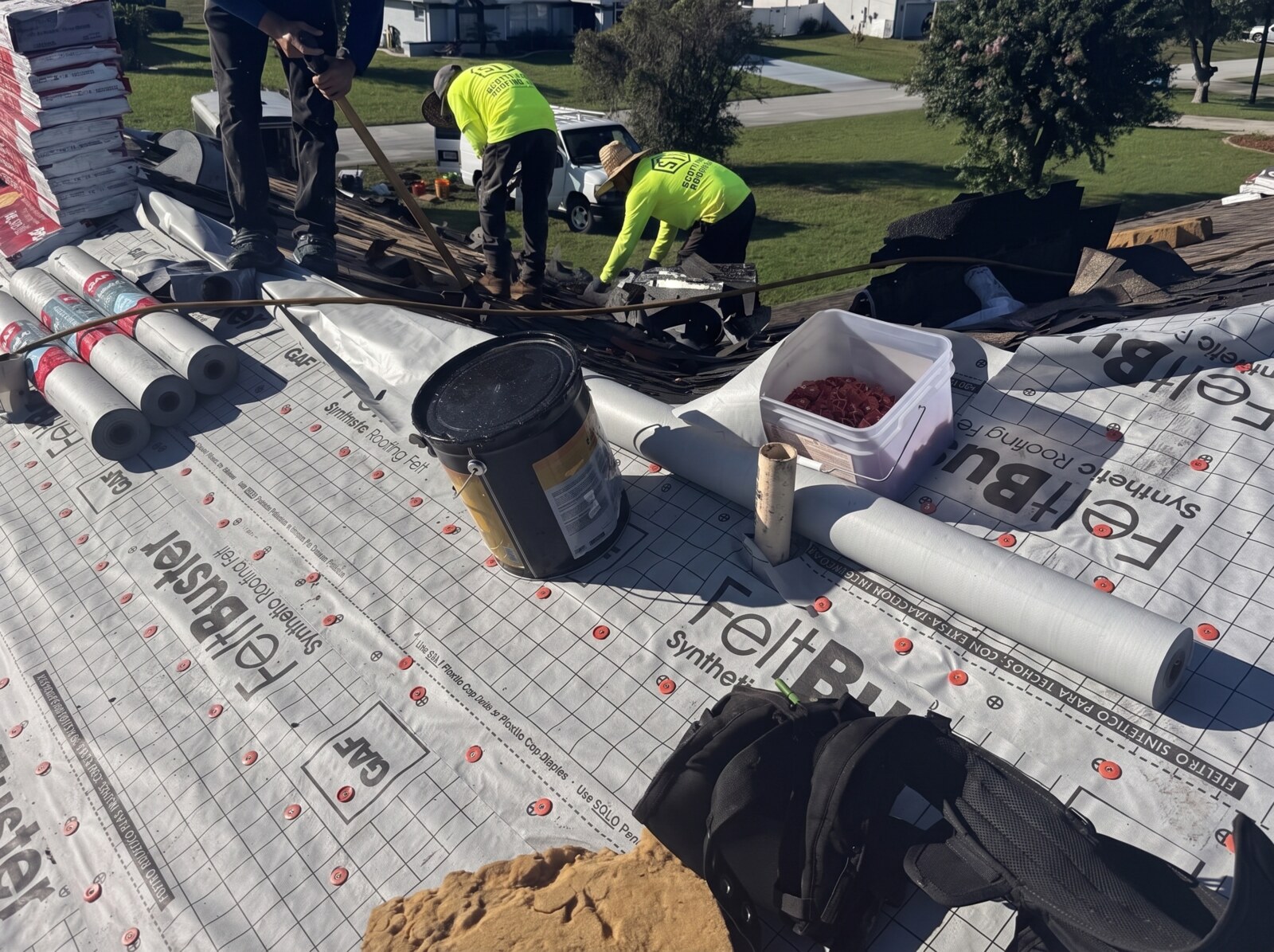 Scotti Family Roofing crew and staged materials at a Spring Hill FL roof replacement